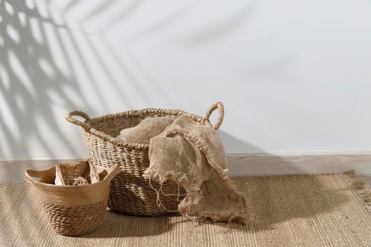 Storage room. Wooden stairs, wicker baskets on a mat. Copy space. Place for text. Copy space