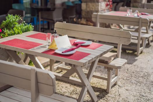 Cozy Interior Of Summer Cafe Cutlery Laid Out.