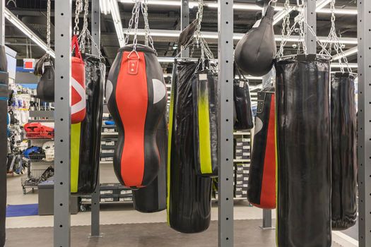 punching bags for martial arts on store shelves. photo