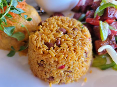 plate of plantains rice and fried pork and broth in Puerto Rico