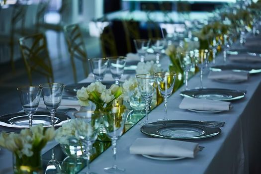 Fancy wedding reception area ready for guests and the party. Shallow dof