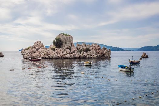 Picturesque summer view of Adriatic sea coast in Budva Riviera near Przno village. Cozy beach and buildings on the rock. Location: Przno village, Montenegro, Balkans, Europe.