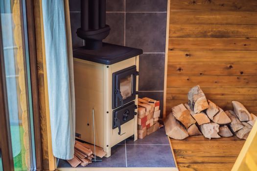 Rest in the mountains in Glamping. Cozy fireplace in a mountain house.