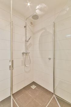 Design of a modern bathroom with a glass shower in a modern house