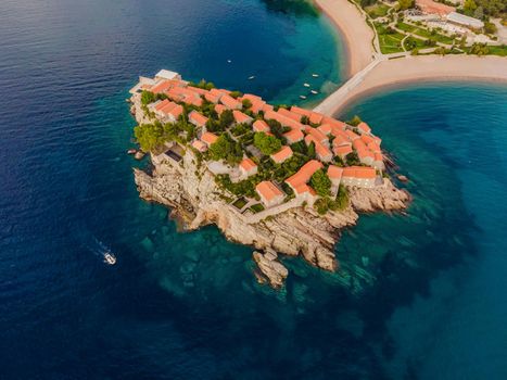 Aerophotography. View from flying drone. Panoramic view of Sveti Stefan island in Budva in a beautiful summer day, Montenegro. Top View. Beautiful destinations.