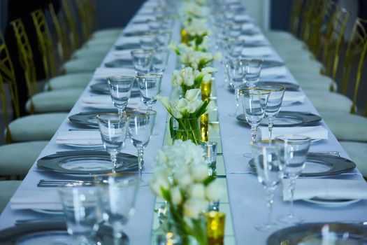 Elegance table set up with lotus flowers, selective focus