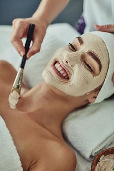 Shot of an attractive young woman getting a facial at a beauty spa.