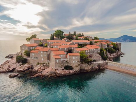 Aerophotography. View from flying drone. Panoramic view of Sveti Stefan island in Budva in a beautiful summer day, Montenegro. Top View. Beautiful destinations.
