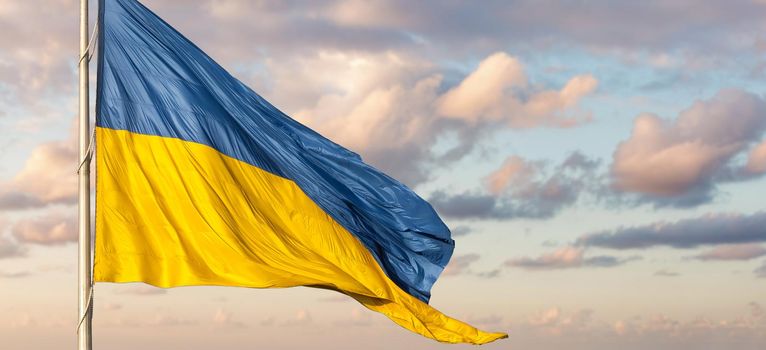 Ukraine flag isolated on the sky with clipping path. close up waving flag of Ukraine. flag symbols of Ukraine.