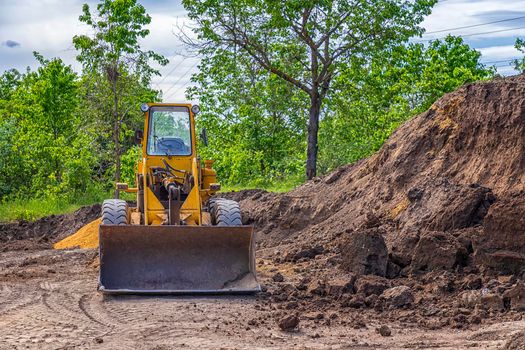 yellow bulldozer with a shovel at the construction site