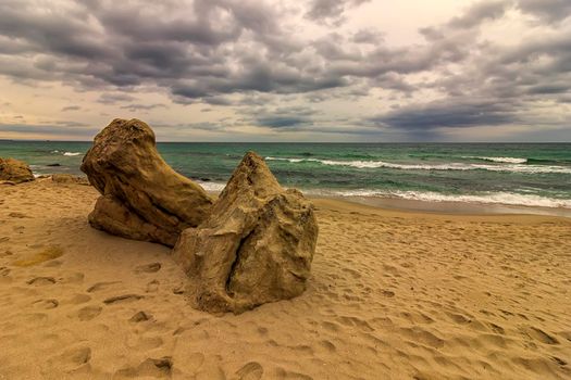 Landscape with Interesting big rock on the shore at cloudy day