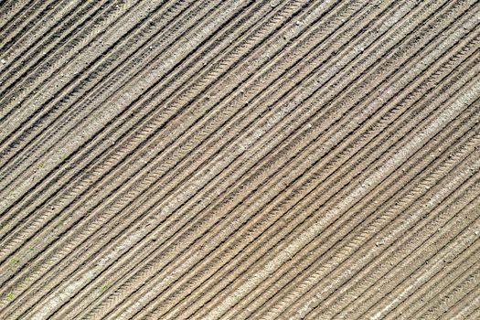 Clear plowed field with traces. View from the top.