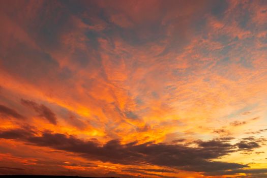 Stunning colorful clouds at the sky. Amazing view on the dramatic sunset sky