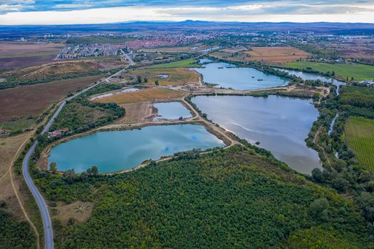 Amazing aerial view from the drone of beautiful countryside with lakes and road