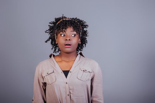 Exams is coming. Attractive afro american woman in casual clothes in the studio.