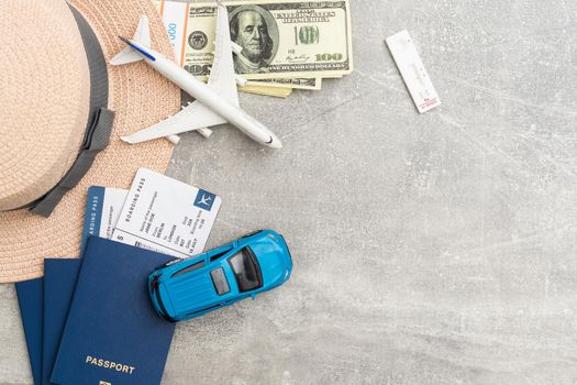 Syringe, toy plane, medical mask and passport with certificate of vaccination with text 'Covid-19 Vaccinated' inside. Travel concept during the Covid-19 pandemic