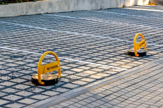 Metal barriers for private outdoor parking lot.