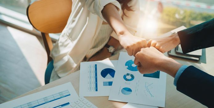 Teamwork Join Hands Support Together Collaboration Concept. Asian business people show symbolic hand for promised purpose to achieve the goal.