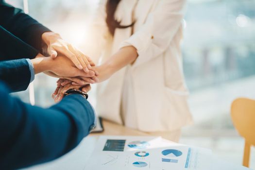 Teamwork business join hand together concept, Business team standing hands together, Volunteer charity work. People joining for cooperation success business.