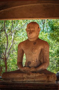 Samadhi Buddha meditating Buddha image ancient statue in Anuradhapura - famous tourist attraction and archaelogical site, Sri Lanka