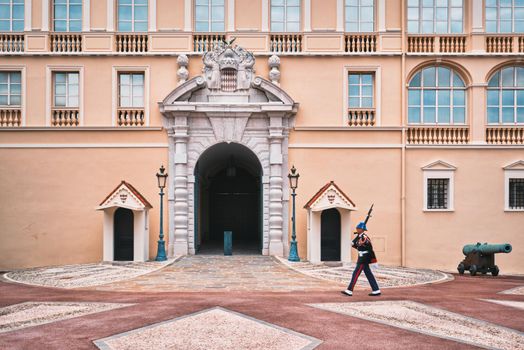 Motion blurred marching sentry guard in front of entrance of Prince's Palace of Monaco. Monte Carlo, Monaco