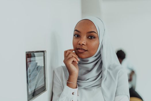 African woman using a smart home screen control system. High-quality photo