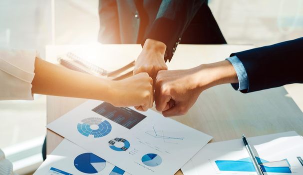 Teamwork Join Hands Support Together Collaboration Concept. Asian business people show symbolic hand for promised purpose to achieve the goal.