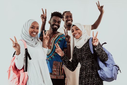 Group of happy African students having a conversation and team meeting working together on homework girls wearing traditional Sudan Muslim hijab fashion. High-quality photo