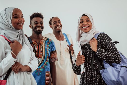 Group of happy African students having a conversation and team meeting working together on homework girls wearing traditional Sudan Muslim hijab fashion. High-quality photo