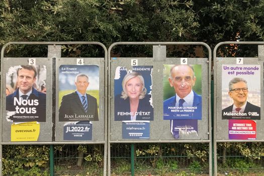 PARIS, FRANCE - APRIL 06, 2022 : The banners with candidates for President elections