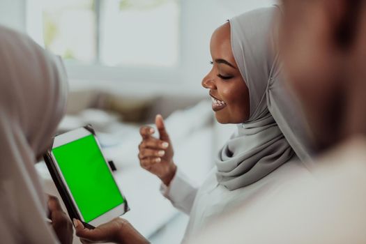 Group of happy African students having a conversation and team meeting working together on homework girls wearing traditional Sudan Muslim hijab fashion. High-quality photo