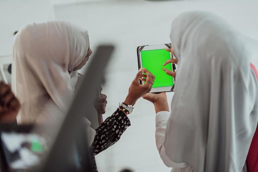 Group of happy African students having a conversation and team meeting working together on homework girls wearing traditional Sudan Muslim hijab fashion. High-quality photo