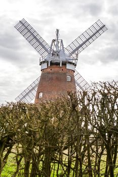 Dunmow, Essex, UK - September 2019, . A traditional old English windmill near the Essex village of Thaxted set against a blue summer sky.