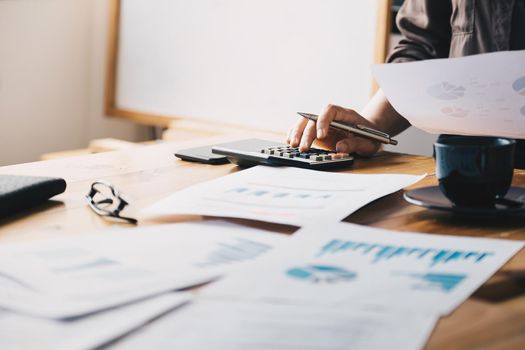 Close up view of bookkeeper or financial inspector hands making report, calculating or checking balance. Home finances, investment, economy, saving money or insurance concept