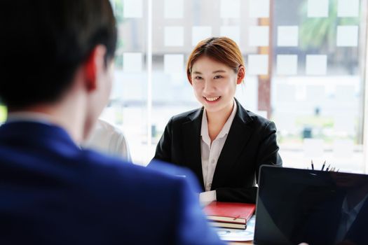 Brainstorming, consultation, data analysis, planning, marketing, accounting, economics, Asian businesswoman smiling at a meeting