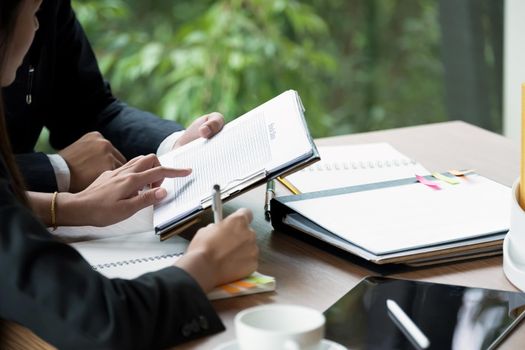 Close up Group of business people busy discussing financial matter during meeting. Corporate Organization Meeting Concept.