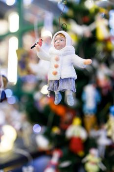 festival Christmas trip. Wadded Christmas toy, girl with a clutch for sale