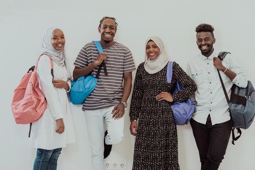 photo of a group of happy African students talking and meeting together working on homework girls wearing traditional Sudanese Muslim hijab. High-quality photo