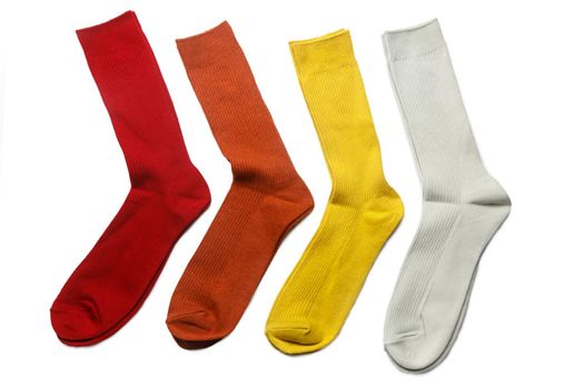 Four pairs of multi-colored socks: yellow, orange, gray, red are on a white background