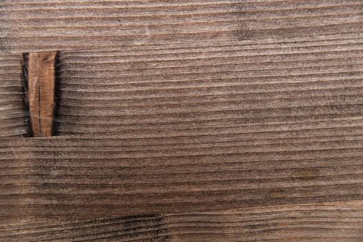 Wooden table structure covered with wood stain. Texture for design solutions