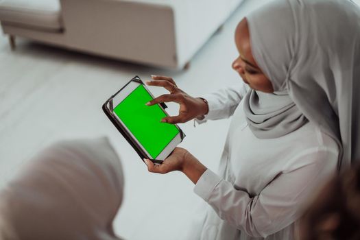 Group of happy African students having a conversation and team meeting working together on homework girls wearing traditional Sudan Muslim hijab fashion. High-quality photo