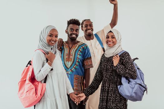 Group of happy African students having a conversation and team meeting working together on homework girls wearing traditional Sudan Muslim hijab fashion. High-quality photo