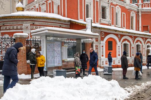 Moscow, Russia - 20 December 2021, Bus stop at Church of All Saints on Kulishki, Moscow, Slavyanskaya square, 2