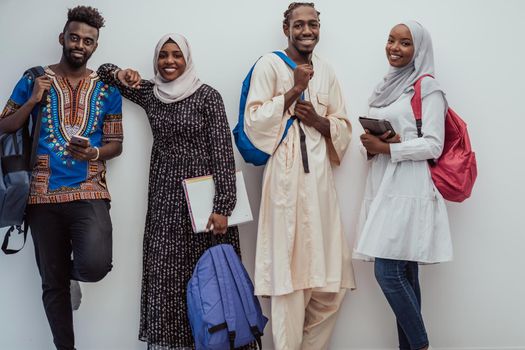 photo of a group of happy African students talking and meeting together working on homework girls wearing traditional Sudanese Muslim hijab. High-quality photo