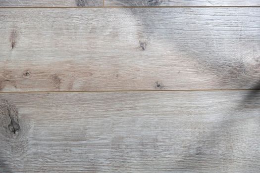 Texture of beige laminate that looks like a wooden plank