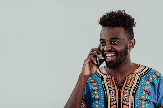 Native Sudan African male using smartphone isolated on white background. High-quality photo