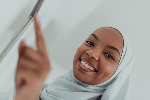 African woman using a smart home screen control system. High-quality photo