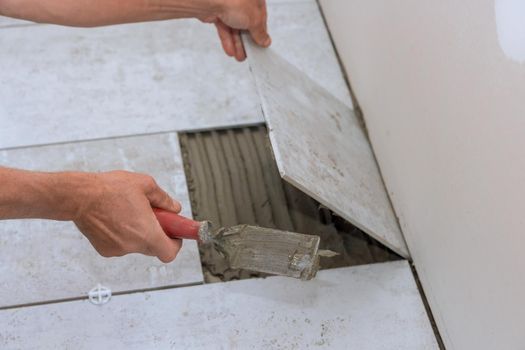 Ceramic tiles installation on adhesive home improvement, renovation