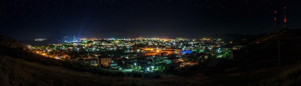 Starry night panoramic shot of Sudak, Crimea. Summer 2014.