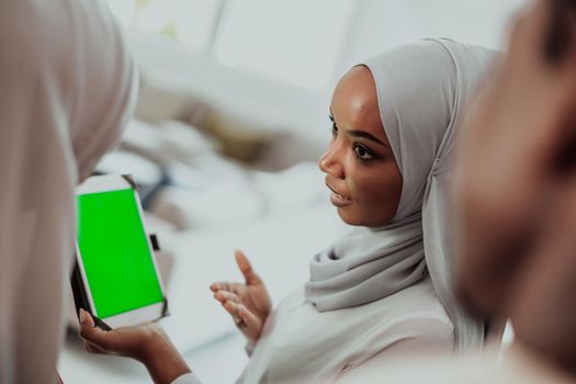 Group of happy African students having a conversation and team meeting working together on homework girls wearing traditional Sudan Muslim hijab fashion. High-quality photo